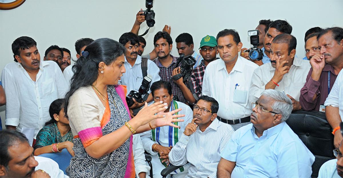 YSRCP MLA R K Roja argues with Acharya Nagarjuna University officials over Rishitheswari suicide, at the university on Thursday